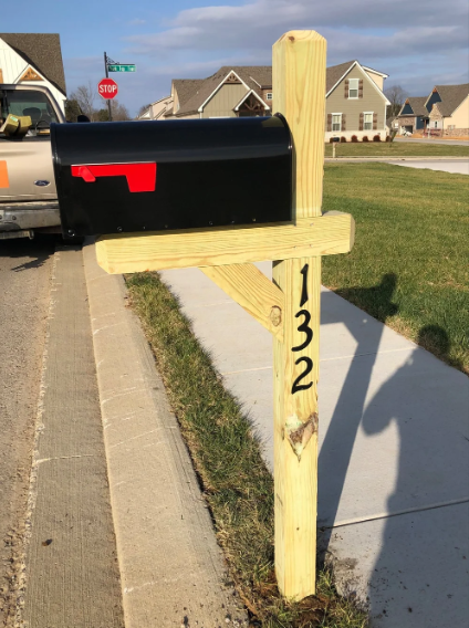 Wood mailbox post with address numbers
